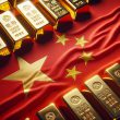 gold bars laying on top of the chinese flag