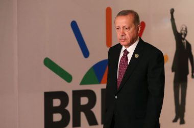 Turkey's Erdogan in front of a BRICS poster