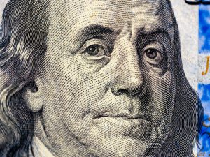 closeup image benjamin franklin bill finance us dollar usd currency