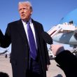 US President Donald Trump takes questions from reporters before boarding Air Force One