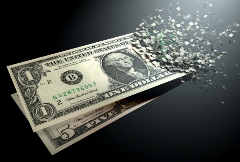 US dollar bill disintegrating into pixels representing fragmentation