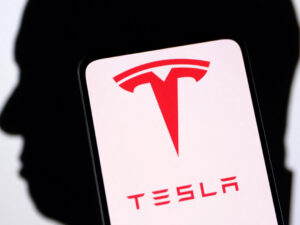Tesla logo displayed on smartphone screen