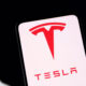 Tesla logo displayed on smartphone screen