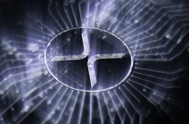 XRP logo illuminated with purple light rays on digital background