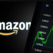 Amazon logo beside stock chart showing upward price movement