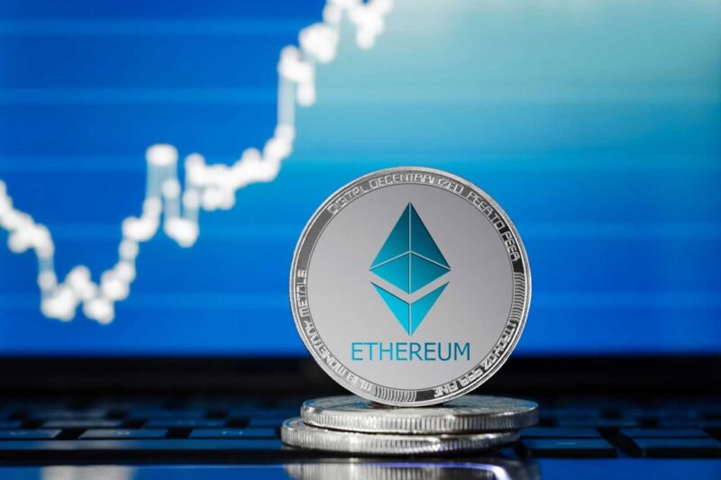 Ethereum coin with upward price chart in the background