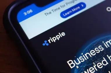 Ripple logo displayed on smartphone with financial interface