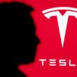 Tesla logo on red background with silhouette shadow