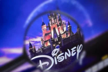 Disney logo with castle in magnifying glass