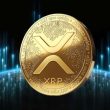 Golden XRP cryptocurrency coin displaying the distinctive 'X' symbol against a dark background with blue digital light effects, representing Ripple's digital asset