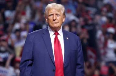 President Trump in blue suit with red tie