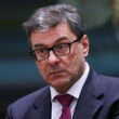 Italian Economy Minister Giorgetti in formal attire with glasses