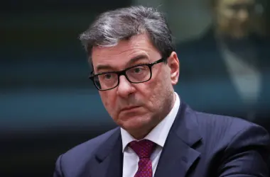Italian Economy Minister Giorgetti in formal attire with glasses