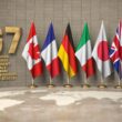 G7 country flags on display with gold G7 logo showing member nations