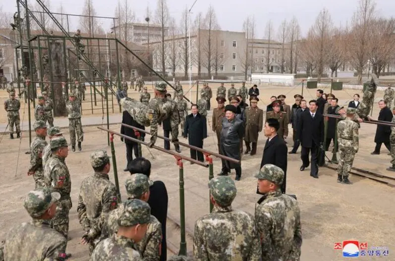 North Korean leader Kim Jong Un inspecting military troops, demonstrating the country's military readiness