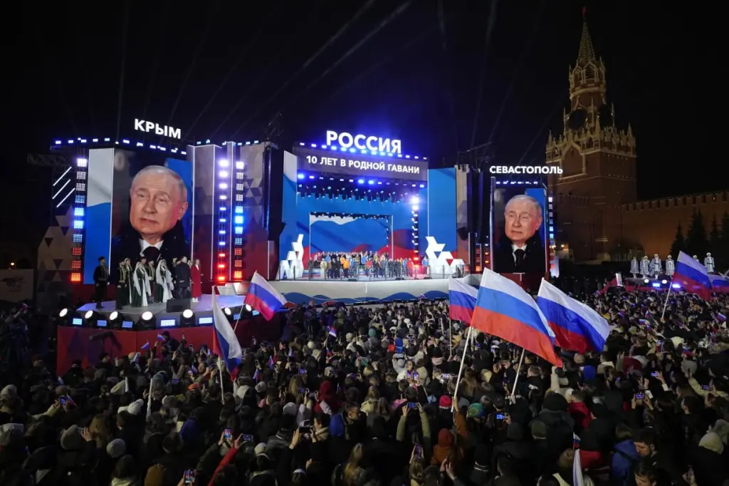 Russian celebration with Putin images and Crimea references.]