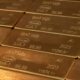 Close-up of gold bars showing 99.99% purity markings