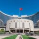 People's Bank of China headquarters building with red flag