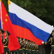 Chinese and russian soldiers with flags