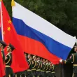 Chinese and russian soldiers with flags