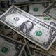 dollar on bed of dollars