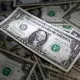 dollar on bed of dollars