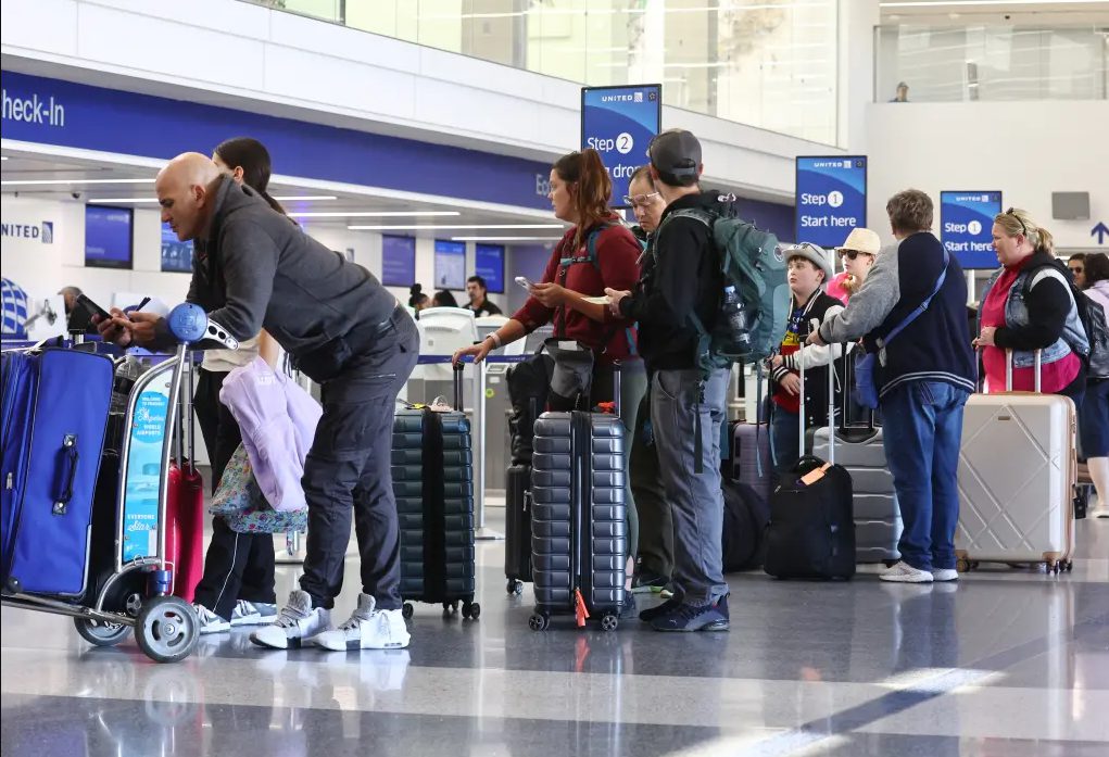 Passengers waiting in airport terminal Alaska Air