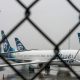 Alaska Airlines planes grounded thorugh chain fence
