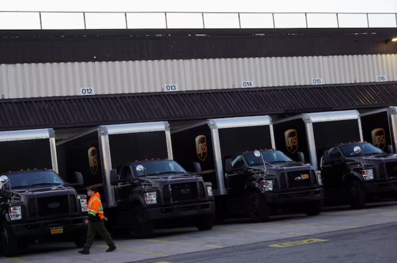 UPS trucks at distribution facility