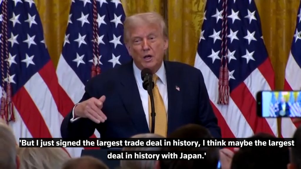 Trump at White House podium announcing Japan deal