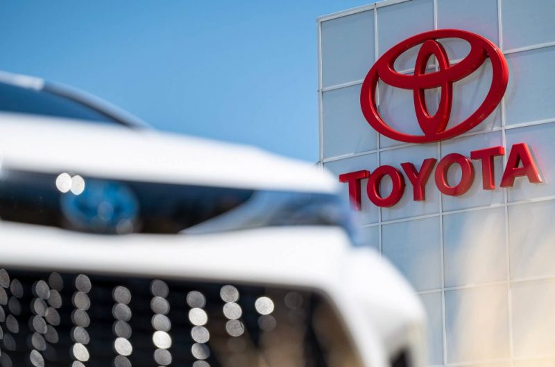 Toyota building and front of car