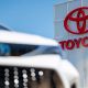 Toyota building and front of car