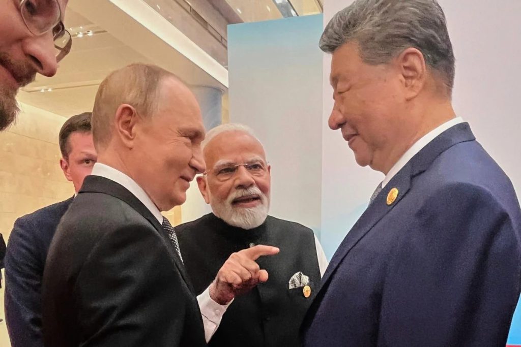 Putin and Modi walking hand-in-hand toward Xi Jinping