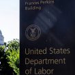 US Department of Labor building sign with Capitol in background