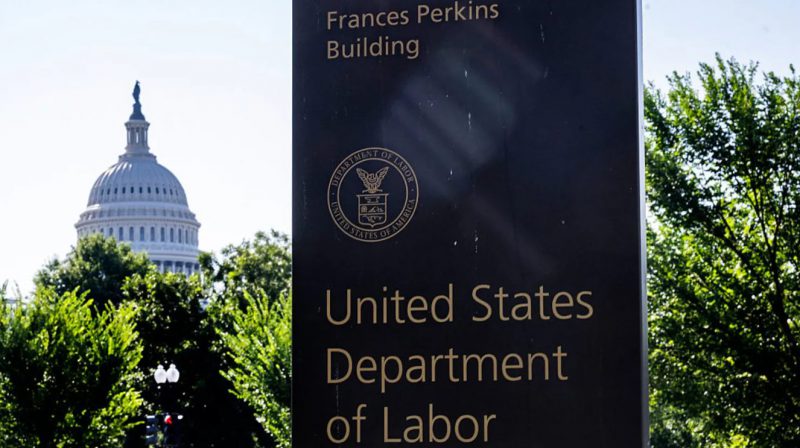 US Department of Labor building sign with Capitol in background