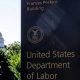 US Department of Labor building sign with Capitol in background