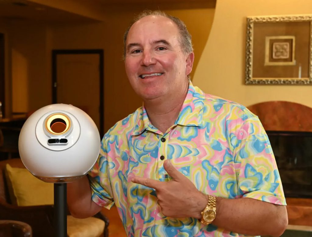 Dan Ives with Worldcoin Orb device