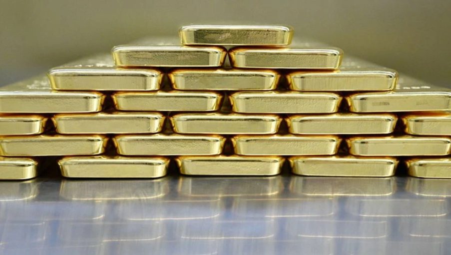 Gold bars stacked in storage