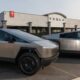 Tesla dealership with Cybertrucks parked